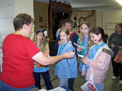 Lisa and Karen sing tags with the Girl Scouts 