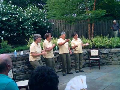 After Hours singing at a fundraiser in a Secret Garden
